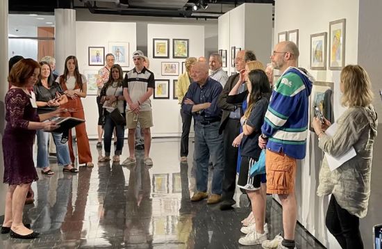 Visitors tour the Mary Cosgrove Dolphin Gallery