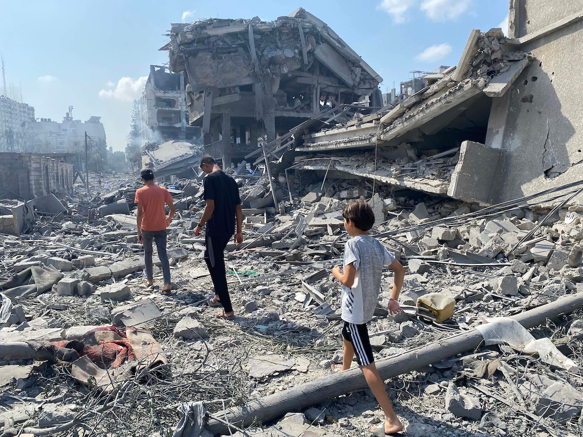 Palestinians inspect the damage following an Israeli airstrike on the El-Remal aera in Gaza City on October 9, 2023. Photo by Naaman Omar for Palestinian News & Information Agency (WAFA) in contract with APAimages, CC BY-SA 3.0 , via Wikimedia Commons