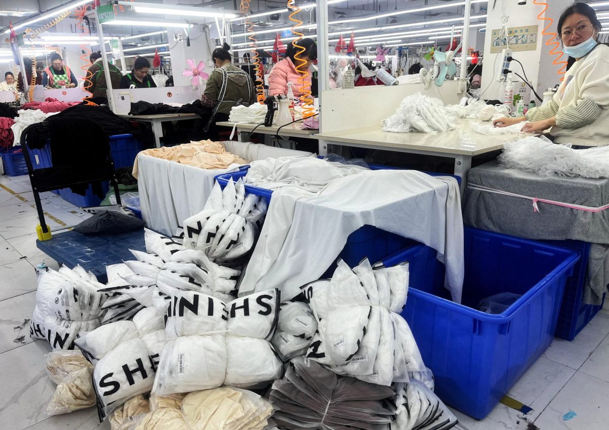 Workers work at a production line manufacturing clothing for Shein at a factory in Guangzhou, Guangdong province, China April 1, 2025. REUTERS/Casey Hall