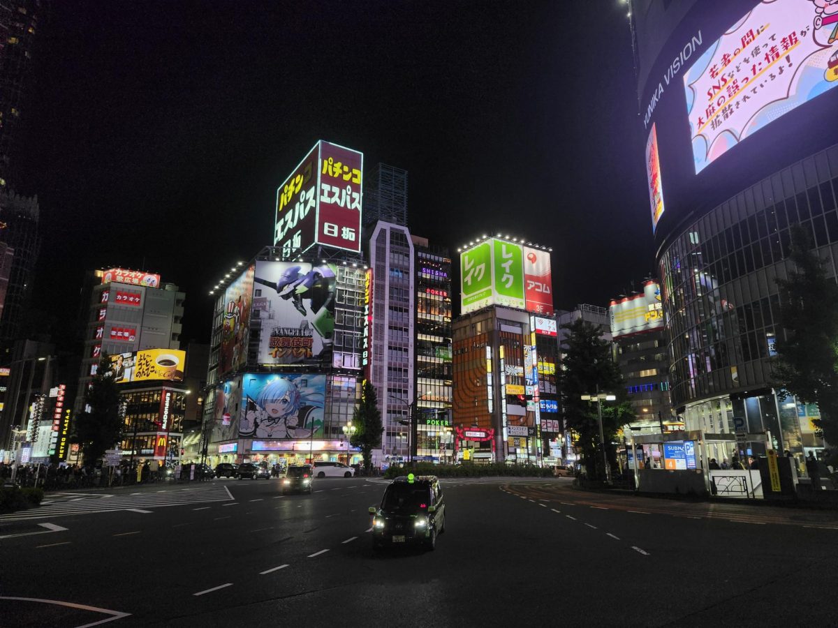 A square in Shinjuku, Japan at nighttime.